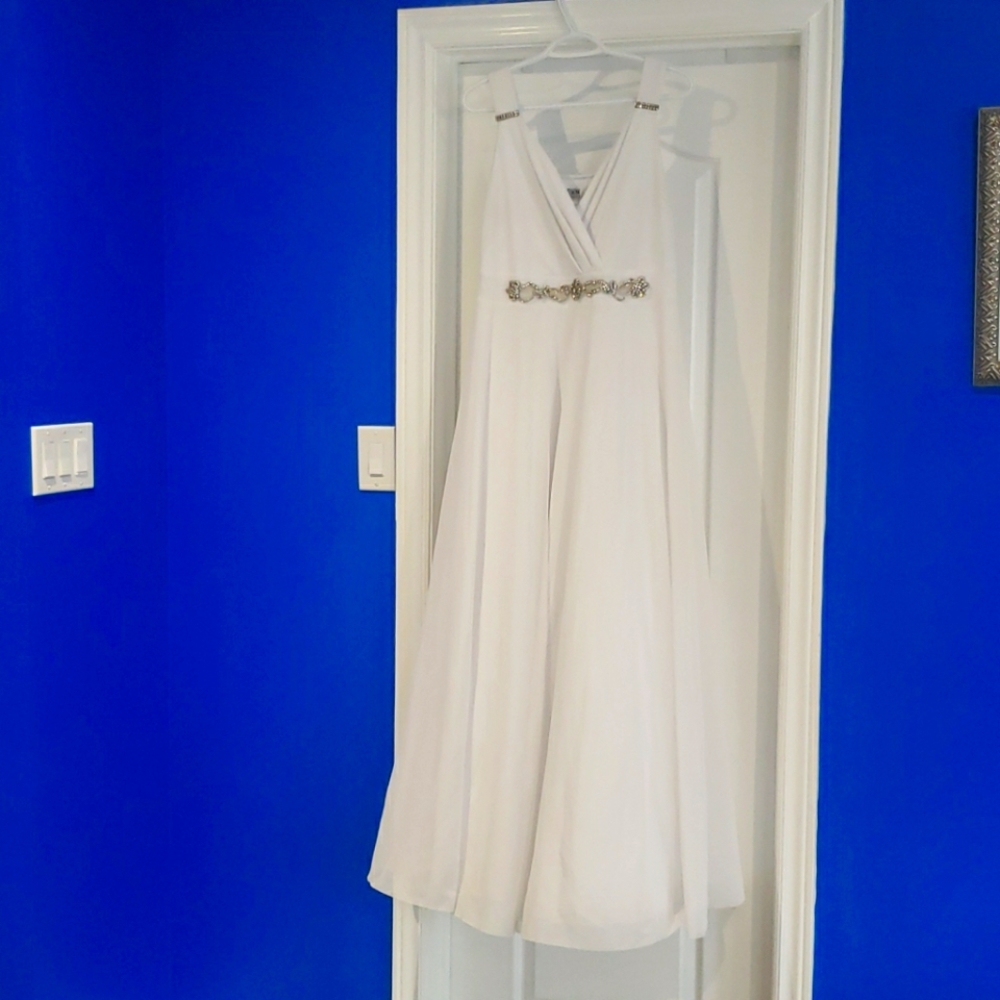 Dress. Worn once to a wedding and dry cleaned.
